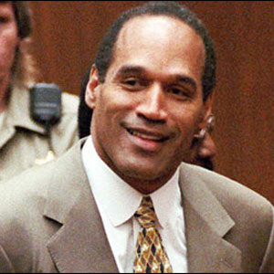 OJ Simpson smiling in the court room, after having been told he'd just gotten away with murder.