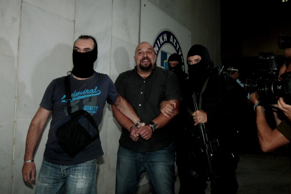 Ilias Panayiotaros, when arrested, said "Shame on them, the people will lift Golden Dawn higher."