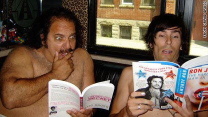 This is a picture of Ron Jeremy and Craig Gross reading each others books, in the same room, with their shirts off. This is not a candid photo, but a professionally staged promo pic. What exactly is it supposed to mean, I wonder?