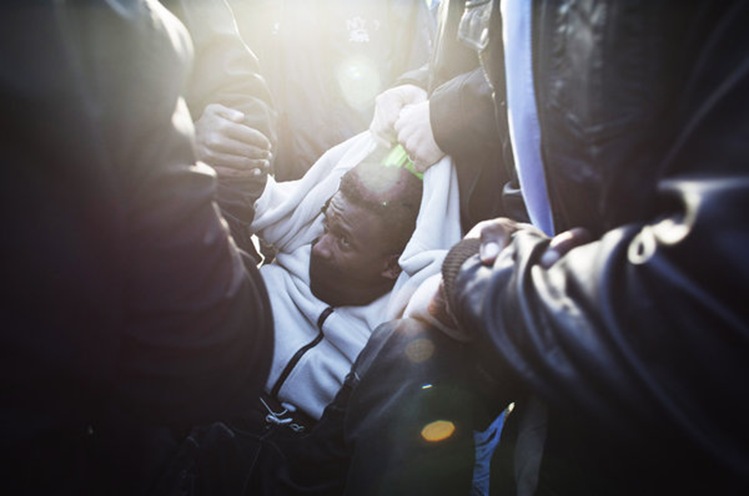 Israeli Police arrest an 'infiltrator' during a demonstration in Jerusalem.