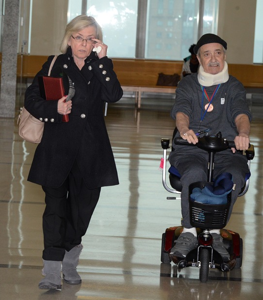 Troy Young's mother with her husband, who are having to listen to the sordid details of what happened to her son.
