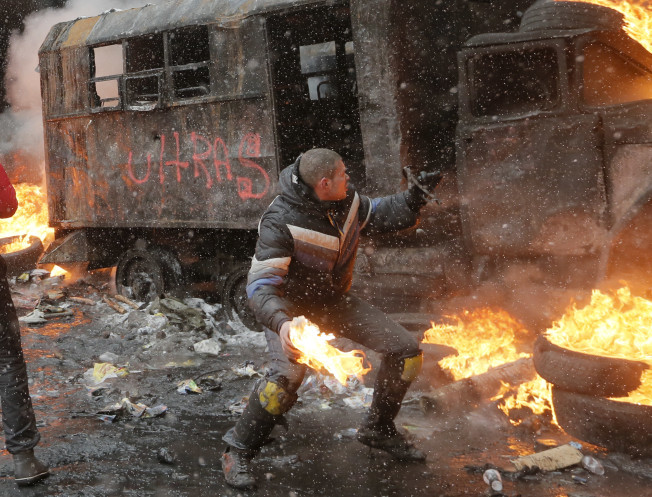 Protester with a molotov cocktail. Just trying to show the government he doesn't like their policies.