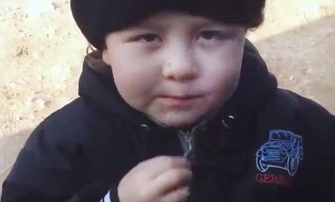 The boy will have lived almost his whole life through the Syrian conflict, though with his high voice and chubby cheeks, he belongs more in infants' school than on a battlefield