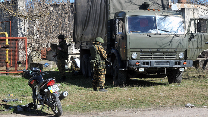 Armed men in military fatigues stand guard in the small Crimean city of Bakhchisaray on March 3, 2014.