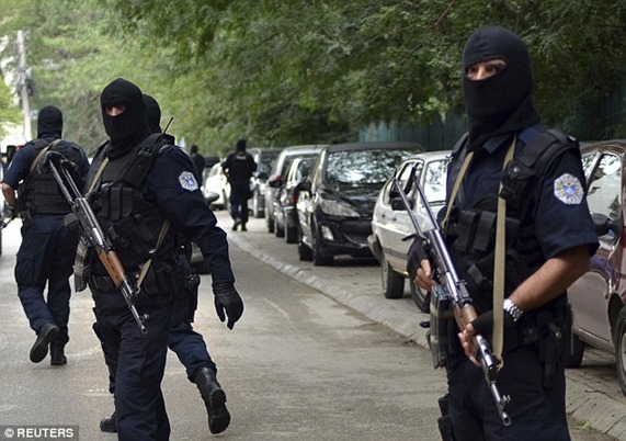 1411039231420_wps_4_Masked_police_officers_ca