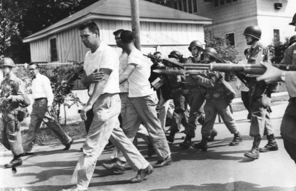 Pupils from Ruby Bridges, an all-White school in New Orleans, are forced by bayonet point to accept “diversity”. (1960)