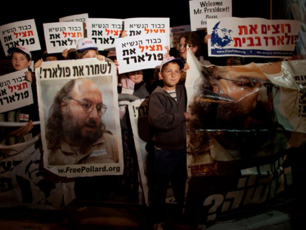 JERUSALEM, ISRAEL - MARCH 19: (ISRAEL OUT) Israelis protest against US President Barack Obama as they call for the release of Jonathan Pollard, a Jewish American who was jailed for life in 1987 on charges of spying on the United States, during a demonstration outside the Israeli President's residence on March 19, 2013 in Jerusalem, Israel. Obama will make his first visit as President to the region tomorrow, and his itinerary will include meetings with the Palestinian and Israeli leaders as well as a visit to the Church of the Nativity in Bethlehem. (Photo by Uriel Sinai/Getty Images)