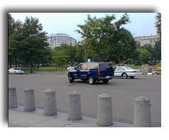 security officer, behind a barricade.