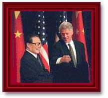 Photograph of Clinton and Jiang Zemin shaking hands