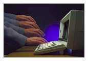 Hand on a computer keyboard
